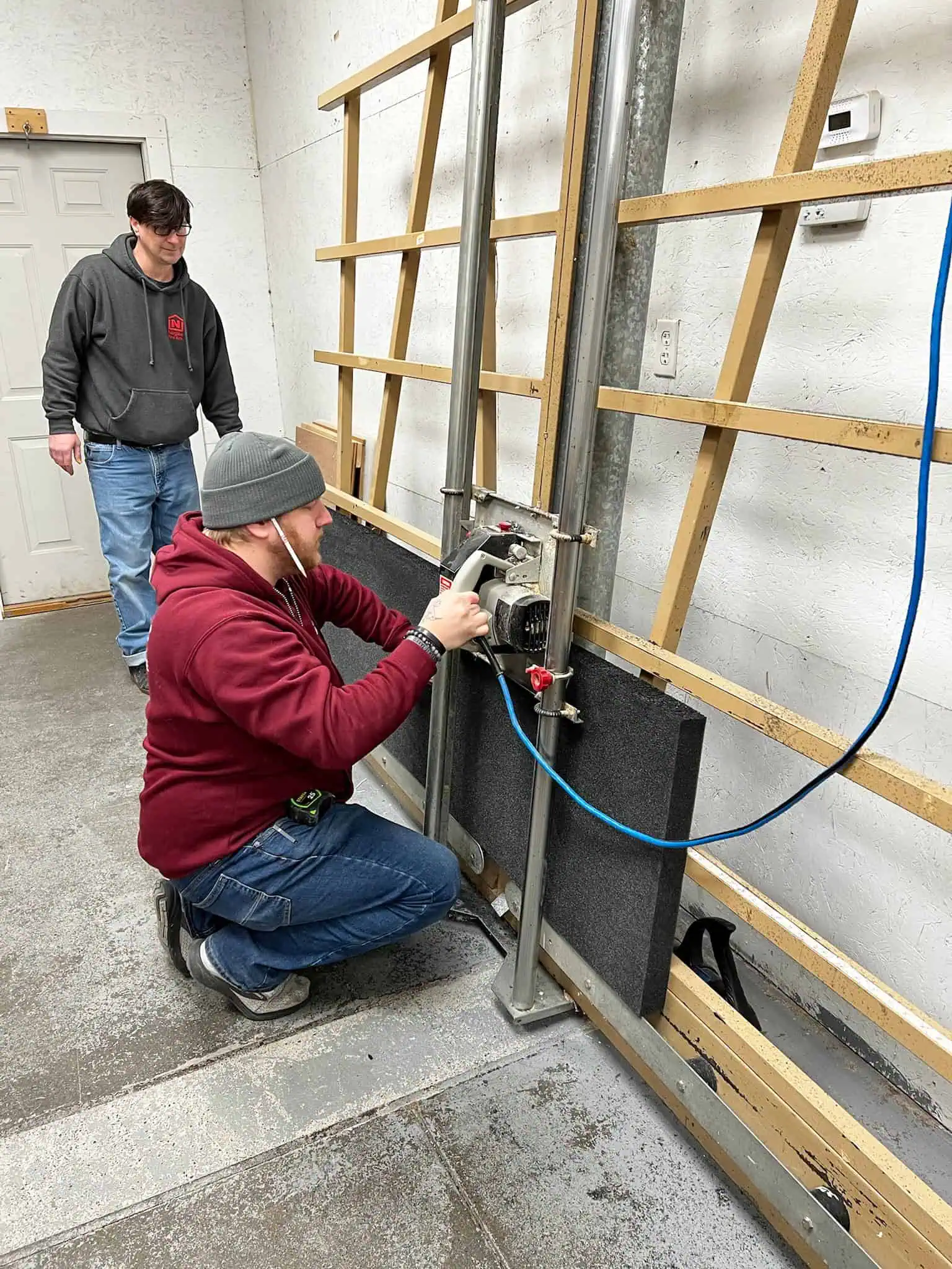 Naglee mover using a power drill to assemble furniture