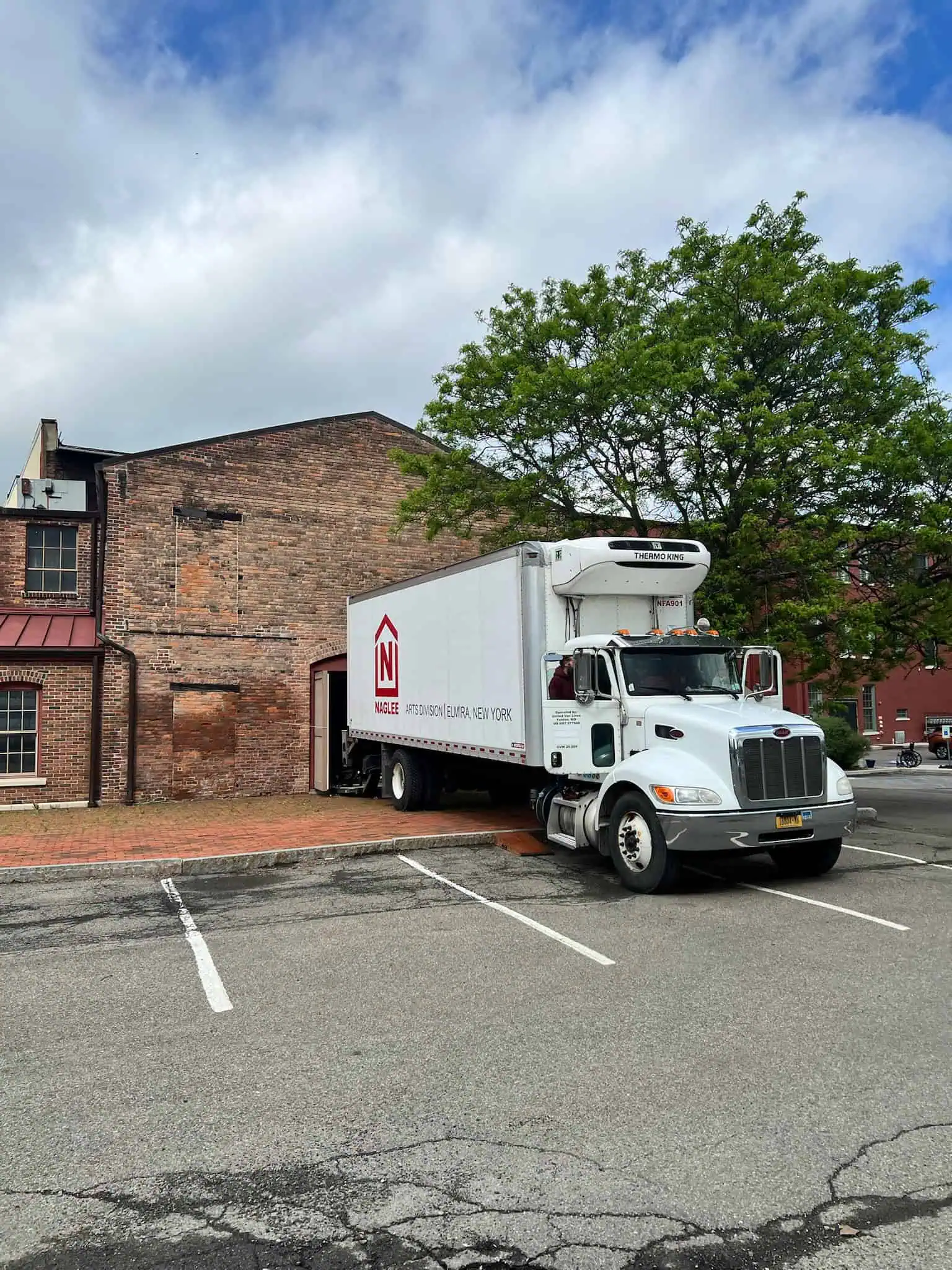 Naglee moving truck on a city street