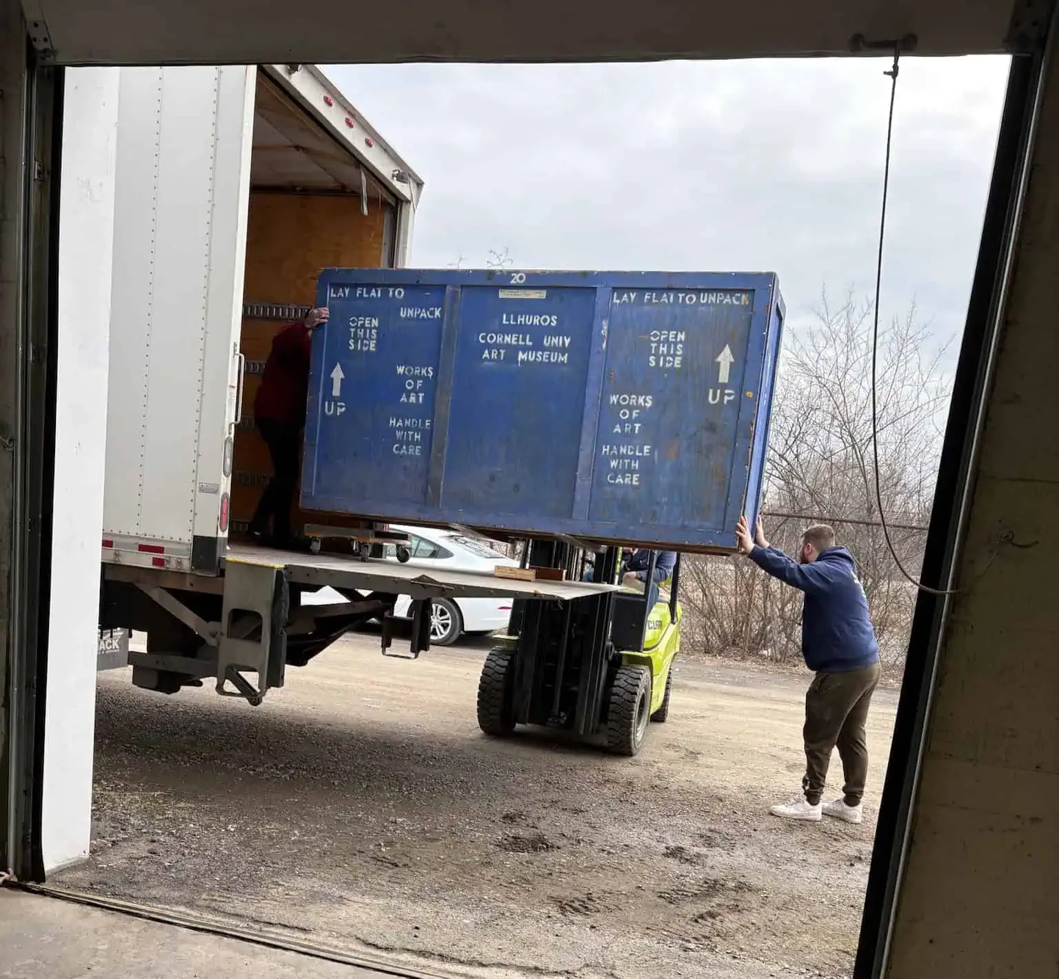 Naglee moving truck parked on a downtown street